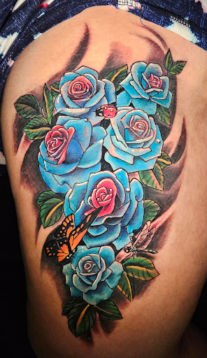 Explore women's hip tattoo ideas, creative tattoo ideas in Angola, available at Hoodlum Ink