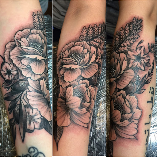 Explore tulip tattoo ideas, creative tattoo ideas in Duluth, available at Tattoo Fiesta