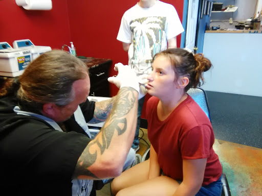 Explore twin tattoos ideas, creative tattoo ideas in Madisonville, available at Living Art Tattoo & Piercing Studio