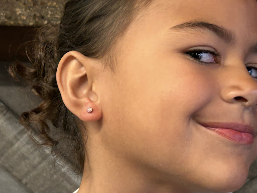 Explore women's lower back tattoo ideas, creative tattoo ideas in San Diego, available at Apogee Body Piercing