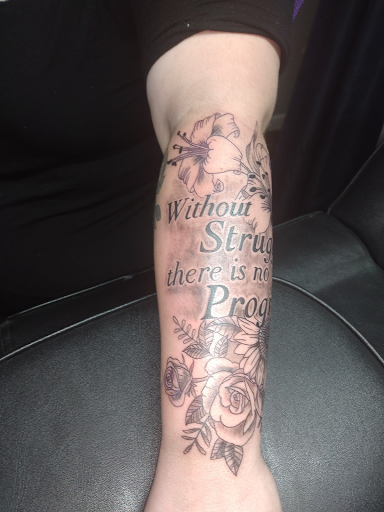 Explore haunted mansion tattoo ideas, creative tattoo ideas in Kewanee, available at Splat Ink tattoos and piercings