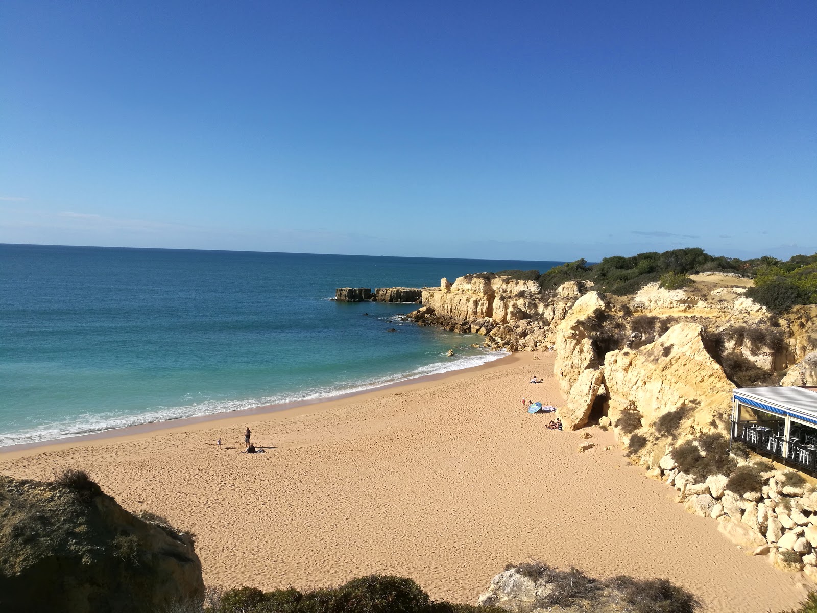 Foto van Praia do Castelo met turquoise puur water oppervlakte