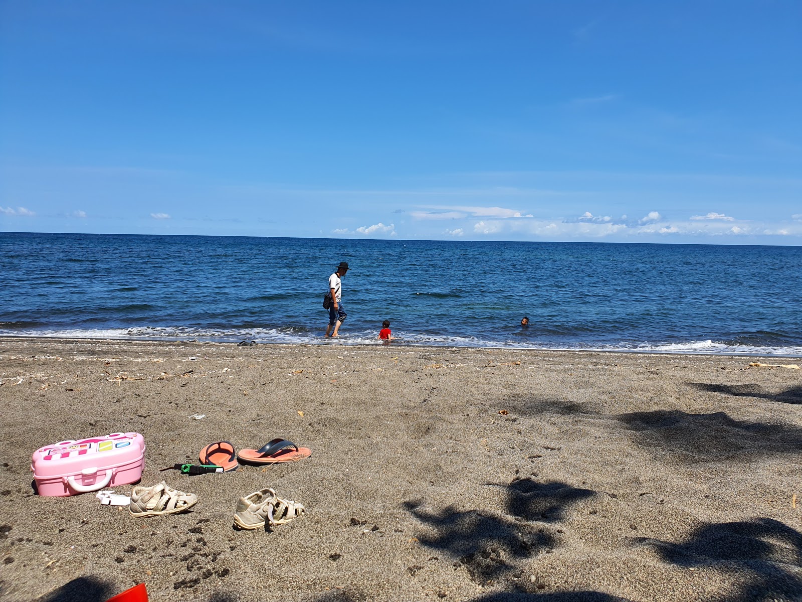 Fotografie cu Tasola Beach cu o suprafață de apa pură turcoaz