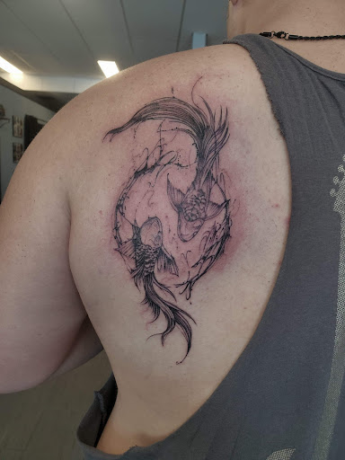 Explore tattoo ideas for women's lower back, creative tattoo ideas in Palm Harbor, available at Angry Owl Tattoo and Piercing