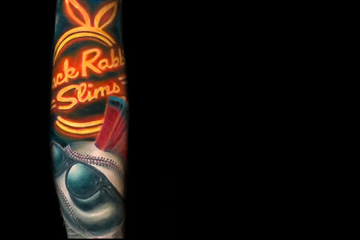 Explore simple silver lining tattoo ideas, creative tattoo ideas in Davenport, available at Ynot Ink Studio