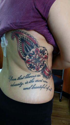 Explore rib tattoo cover up ideas, creative tattoo ideas in Orlando, available at Cast Iron Tattoos