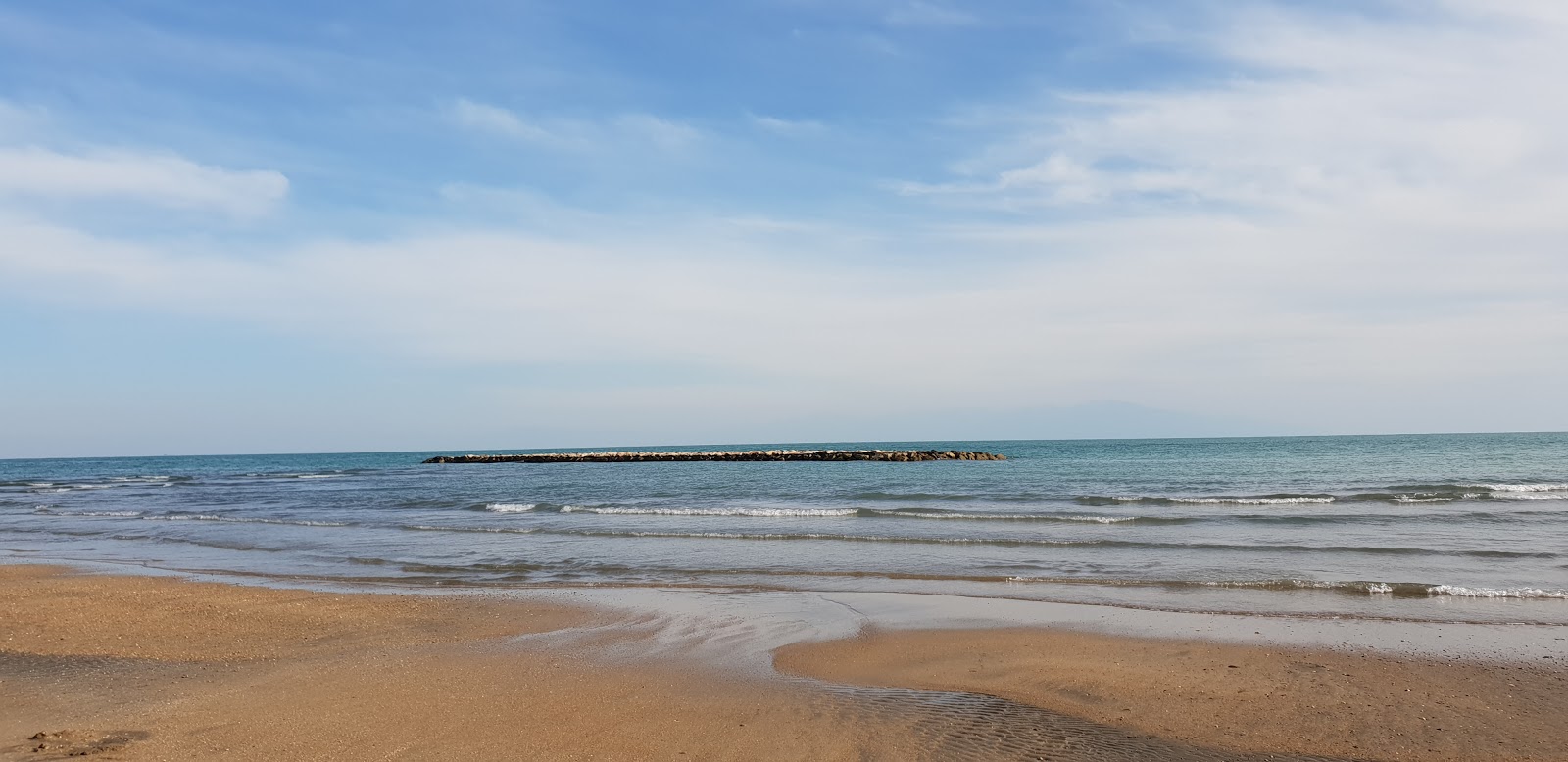 Foto van Ormanalti beach met beige zand oppervlakte