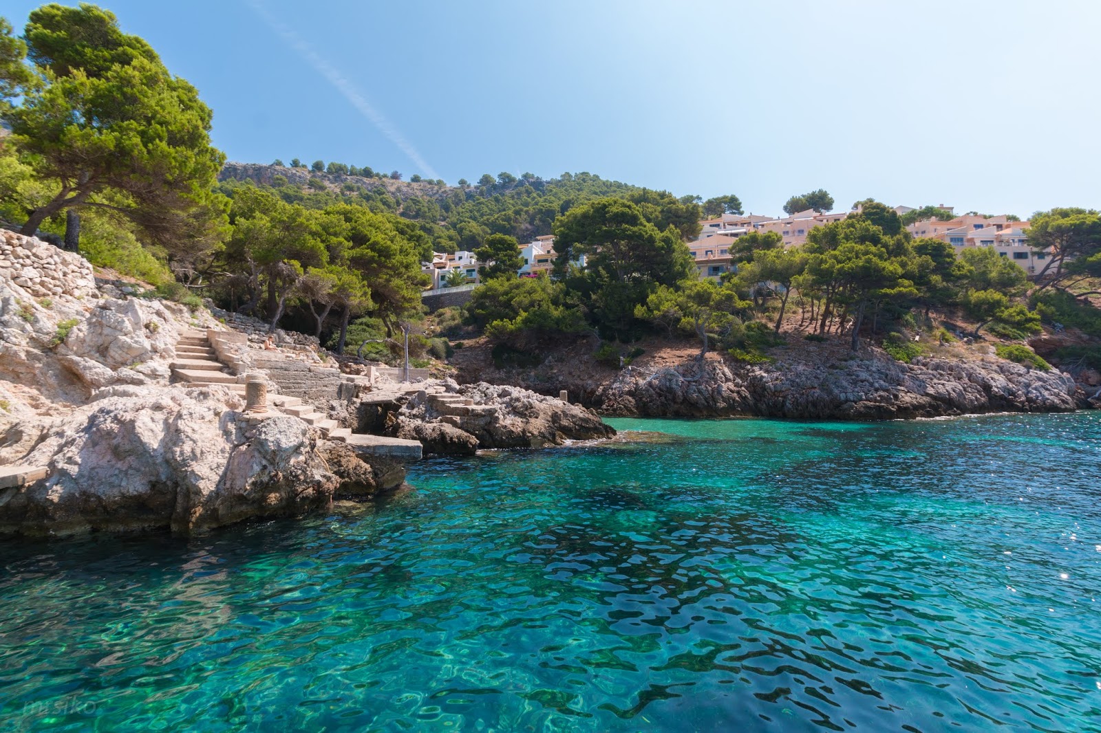 Photo de Cala Serch entouré de montagnes