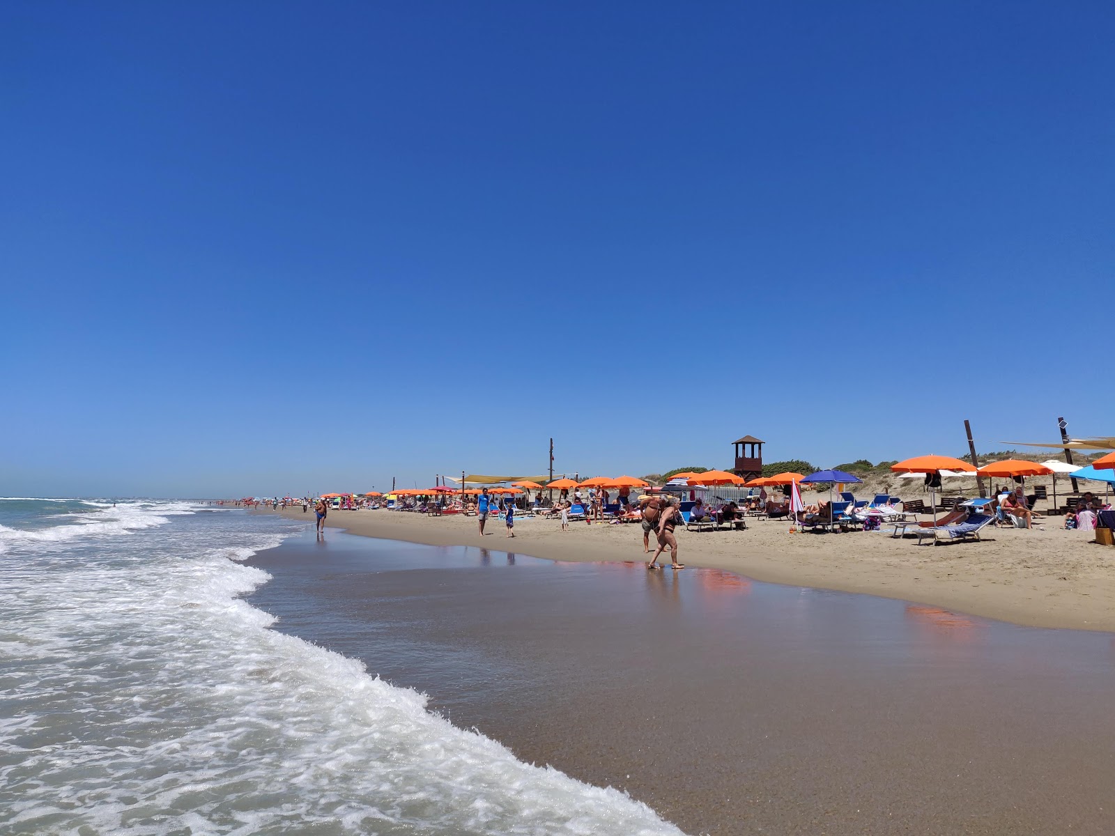 Photo de Plage de Capocotta avec droit et long