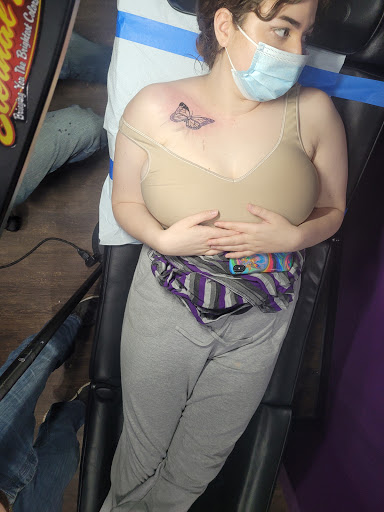 Explore grizzly bear tattoo ideas, creative tattoo ideas in Cleveland, available at Divine Image Ink Tattoo and Piercing Studio