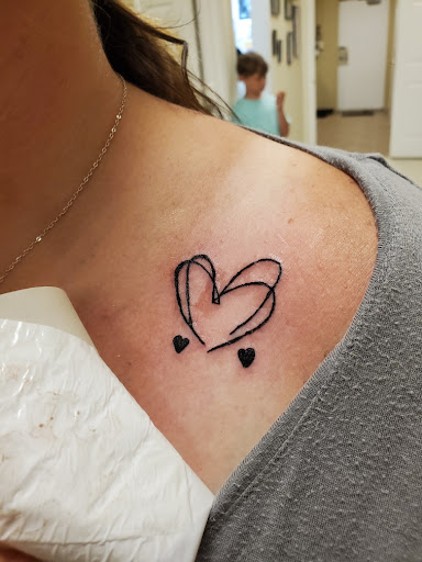 Explore adoption tattoos ideas, creative tattoo ideas in Ozark, available at Tooth & Nail Tattoo & Piercing