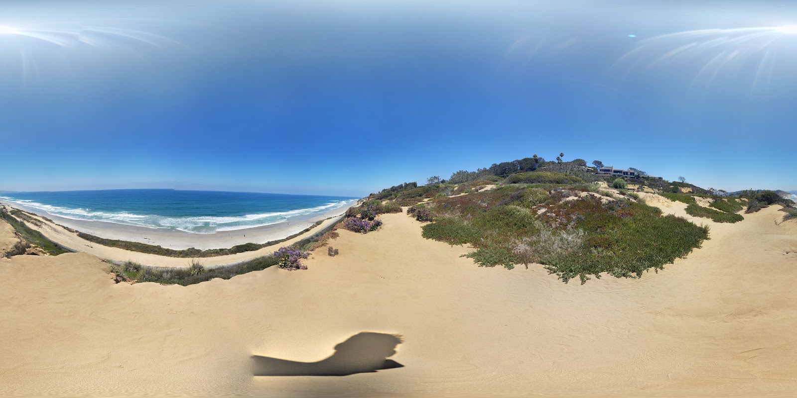 Photo of Torrey Pines beach surrounded by mountains