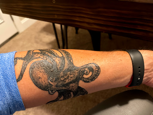 Find robot tattoo ideas for your next unique tattoo in Cornelius at Dermal Designz Tattoo and Piercing Inc.