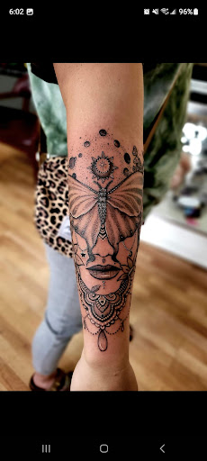 Explore chest tattoo idea, creative tattoo ideas in Benton, available at Spectrum Tattoo