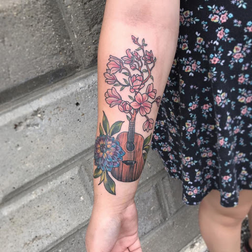 Explore rockstar tattoo ideas, creative tattoo ideas in Mchenry, available at Art and Soul Tattoo Company