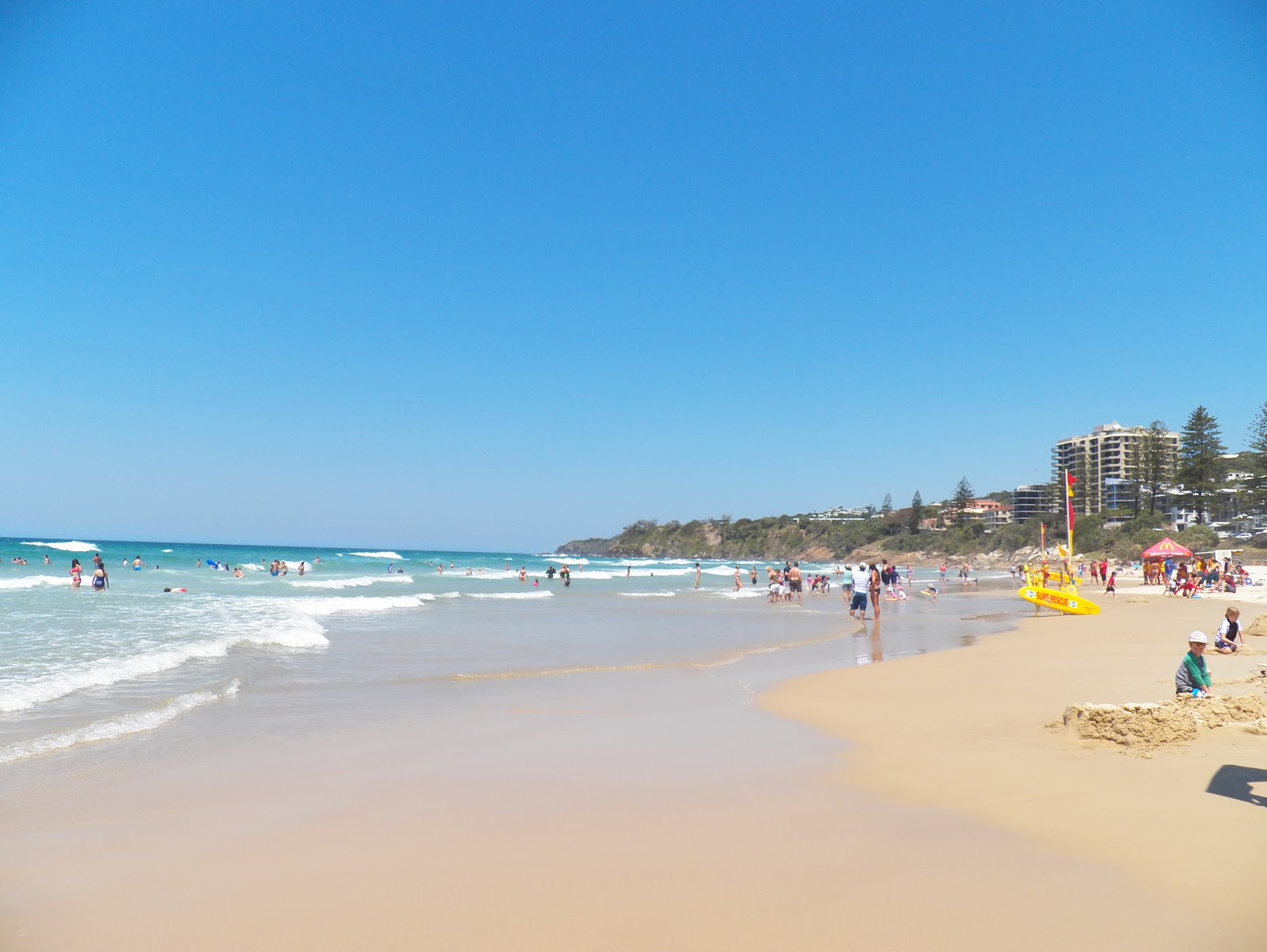 Photo of Coolum Beach with bright fine sand surface