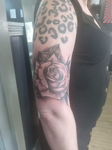 Explore skier tattoo ideas, creative tattoo ideas in Morehead City, available at Wild Poppy Tattoo