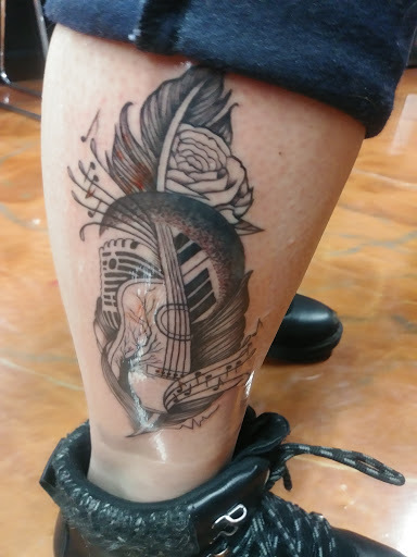 Find leg tattoo ideas for guys for your next unique tattoo in Coeur D Alene at Jojos Tattoo & Body Piercing