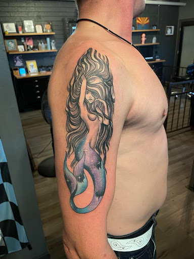 Explore hand tattoos for men ideas, creative tattoo ideas in Peoria, available at Mad Tatter Kustoms