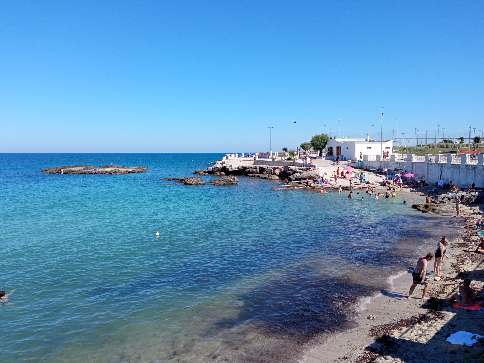 Photo de Cala Porta Vecchia Beach - recommandé pour les voyageurs en famille avec des enfants
