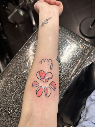 Explore wrist wrap tattoo ideas, creative tattoo ideas in Addison, available at Cat Tattoo