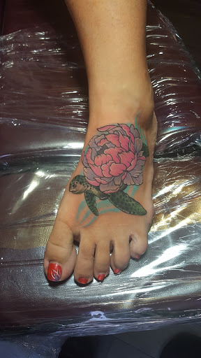 Explore year 2000 tattoo ideas, creative tattoo ideas in Titusville, available at Exclusive Ink Studio