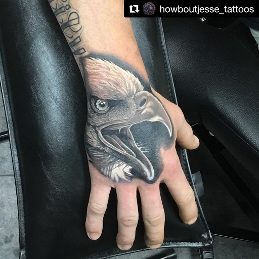 Explore cover up tattoo ideas for lower back, creative tattoo ideas in Bryan, available at The Blackest Crow Tattoo Studio