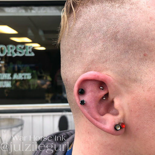 Explore upper leg tattoo ideas, creative tattoo ideas in Kent, available at War Horse Ink