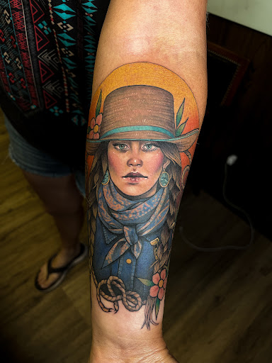 Explore wrap around tattoo ideas, creative tattoo ideas in Fairmont, available at Heretic Ink