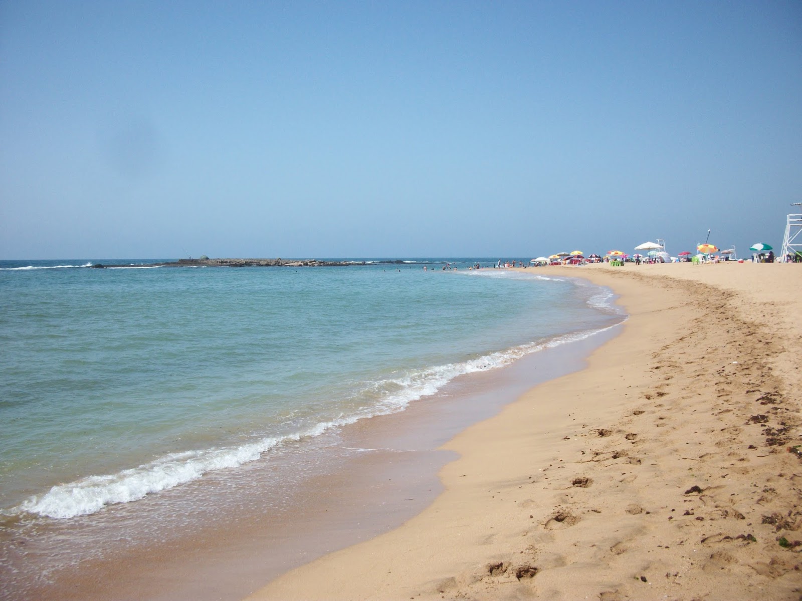 Foto van Dahomey Plage met helder fijn zand oppervlakte