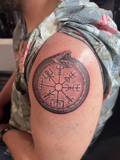 Explore flower arm tattoo ideas, creative tattoo ideas in Kissimmee, available at Fallen Heroes Tattoo & Piercing (Florida)