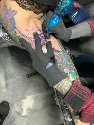 Explore hand tattoos ideas, creative tattoo ideas in Edgewood, available at Evolved Body Arts