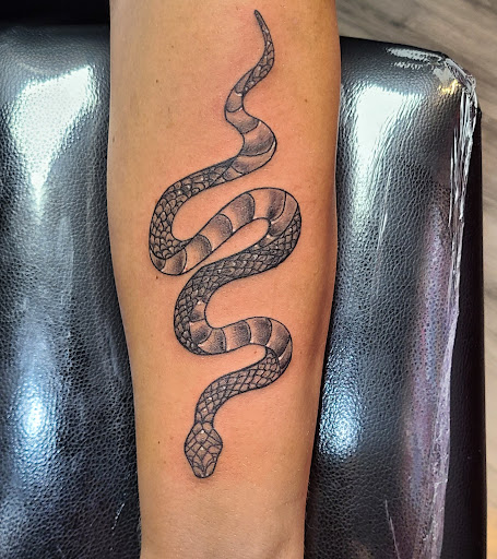 Explore above eyebrow tattoo ideas, creative tattoo ideas in Cumberland, available at Queen City Ink