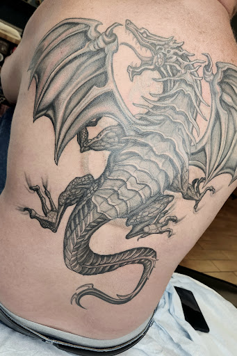 Explore dog lover tattoo ideas, creative tattoo ideas in Stuart, available at Tiger Shark Tattoo Studio