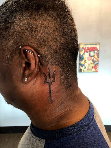 Explore spine tattoo ideas for women, creative tattoo ideas in Palm Harbor, available at Angry Owl Tattoo and Piercing