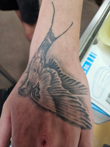 Explore wolf pack tattoo ideas, creative tattoo ideas in Angola, available at Hoodlum Ink