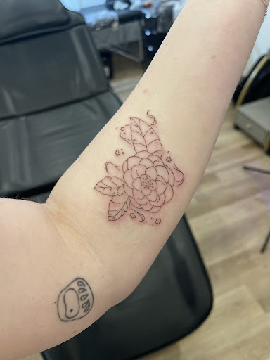 Explore rose tattoo ideas for guys, creative tattoo ideas in Seattle, available at Finer Things Tattoo