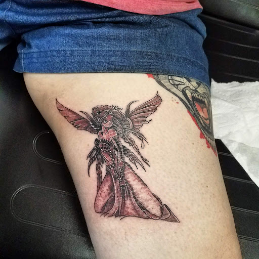 Explore tattoo ideas for women thigh, creative tattoo ideas in Hudson Falls, available at ALTERED ADDICTION TATTOOS