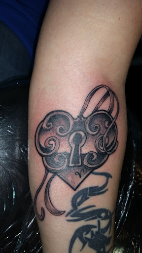 Explore tank tattoo ideas, creative tattoo ideas in Foley, available at Black Sheep Custom Tattoos and Piercings