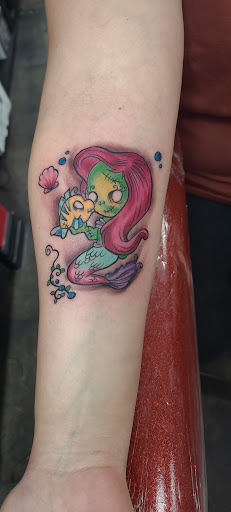 Explore rip cross tattoo ideas, creative tattoo ideas in Garden Grove, available at Dr. Tattoo Studio