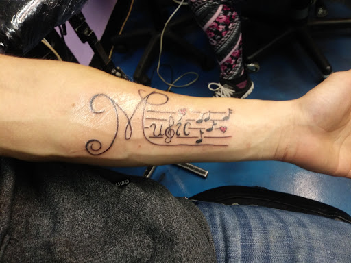 Tattoo Shop «Liquid Tattoo», reviews and photos, 16583 Old U.S. 27, Lansing, MI 48906, USA