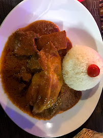 Poulet au curry du Restaurant de spécialités d'Afrique de l'Ouest Le Village à Paris - n°9
