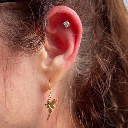 Find under boob tattoo ideas for your next unique tattoo in Cary at Fine Art Body Piercing By Lilith Mae