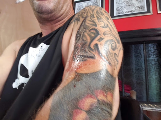 Explore dragon sleeve tattoo ideas, creative tattoo ideas in Toledo, available at Convicted Ink 2