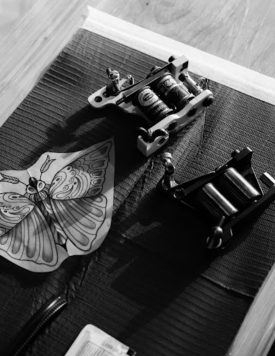 Explore ribbon tattoo ideas, creative tattoo ideas in Venice, available at KISS KISS TATTOO & PIERCING