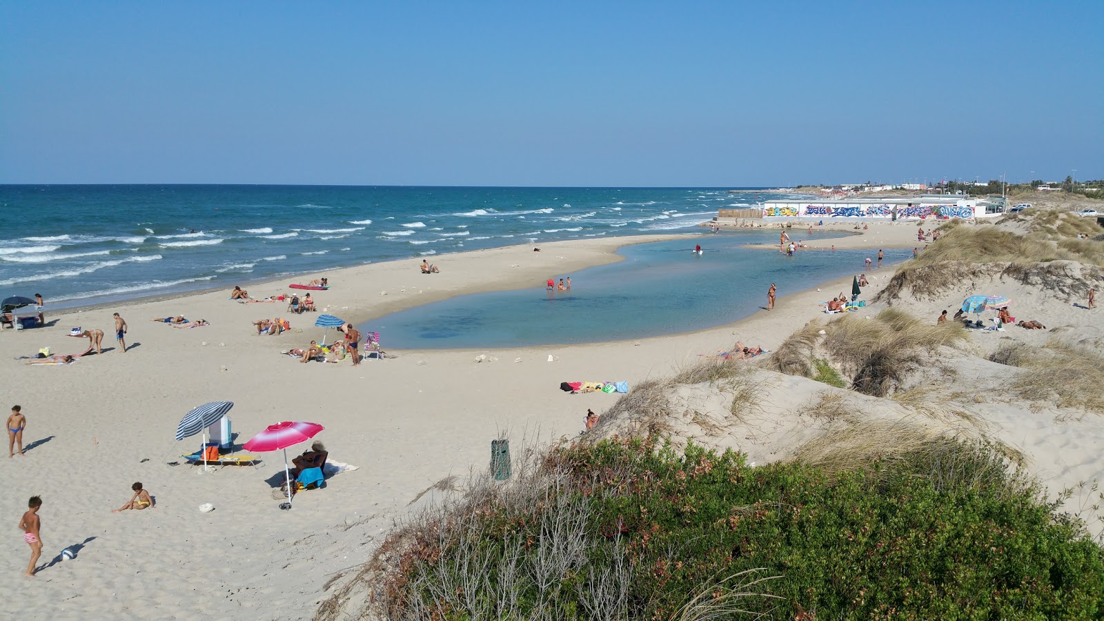 Fotografija Torre Chianca beach z svetel fin pesek površino