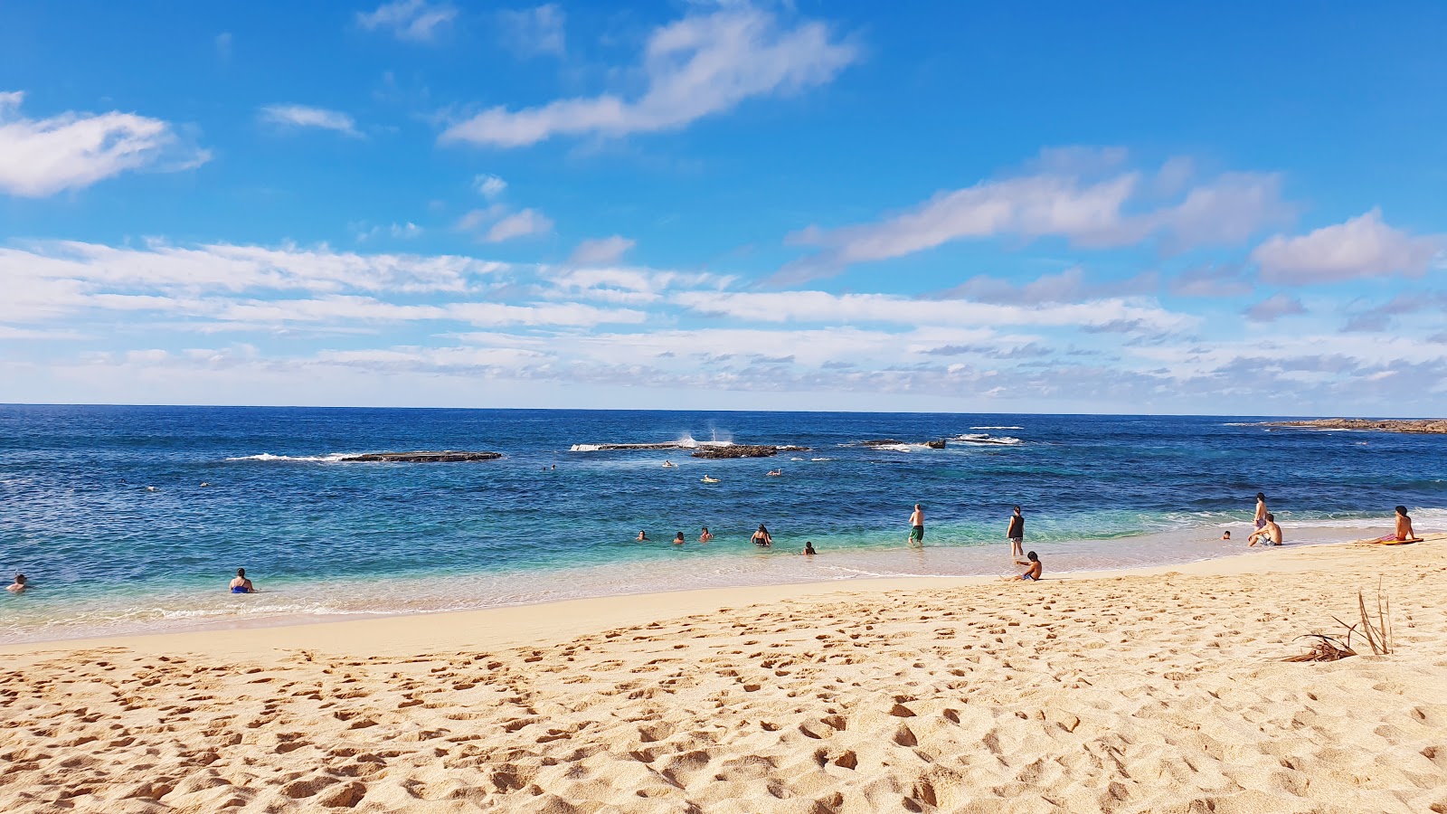 Photo of Three Tables Beach and the settlement