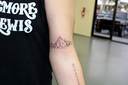 Explore simple silver lining tattoo ideas, creative tattoo ideas in Fort Myers, available at Tiger Lotus Tattoo and Piercing