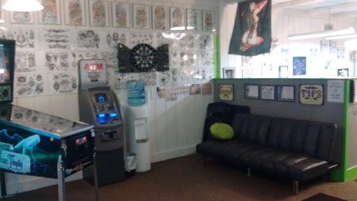 Explore ankle chain tattoo ideas, creative tattoo ideas in Decatur, available at Exclusive Ink Tattoos & Body Piercings 22nd & Wood