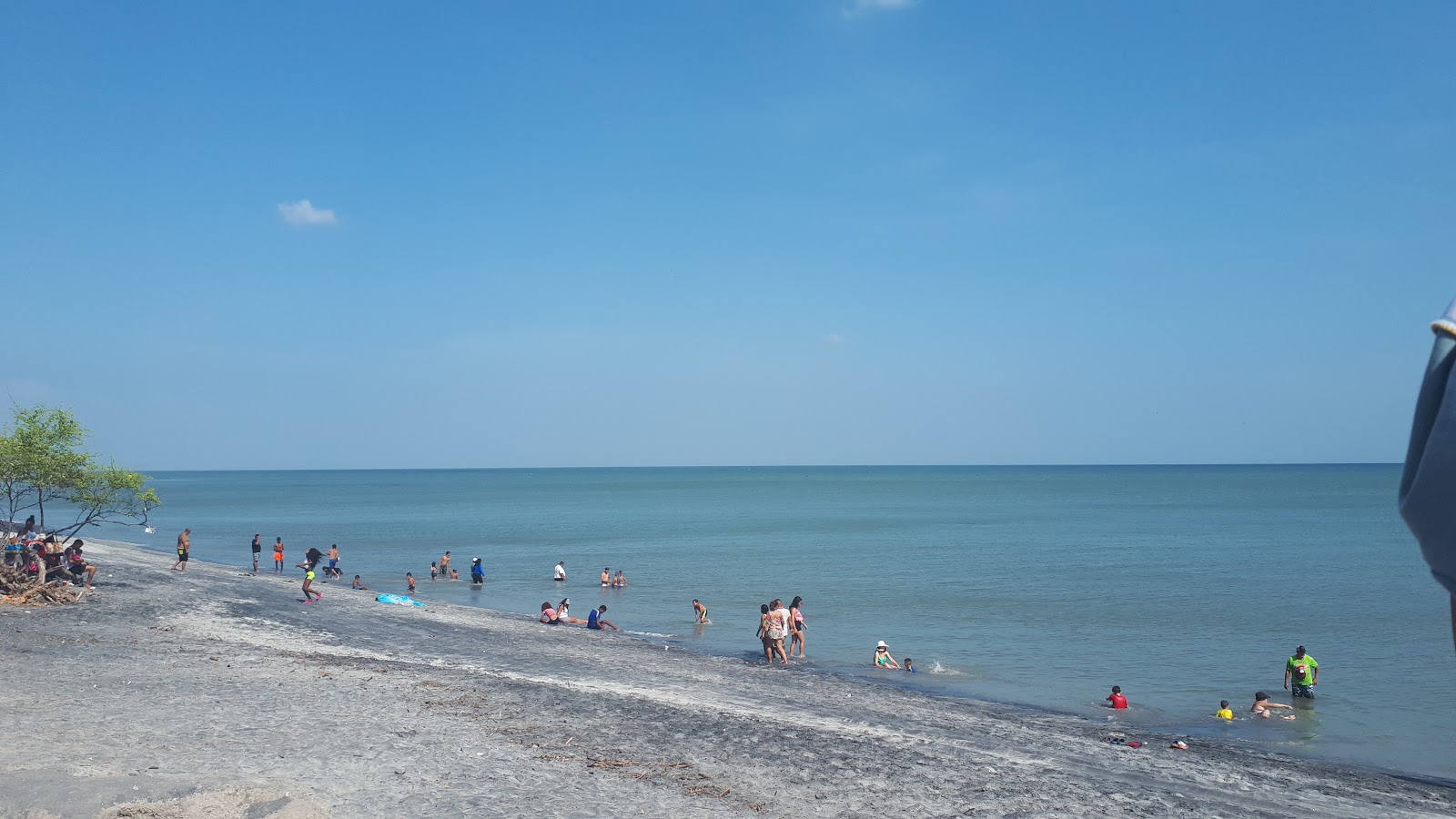 Fotografija Teta Beach z siv pesek površino